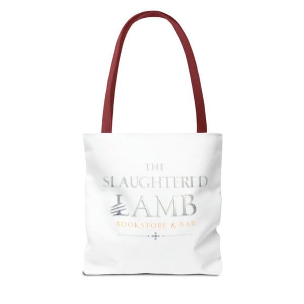 A white tote bag with red handles and an image of the slaughtered lamb.