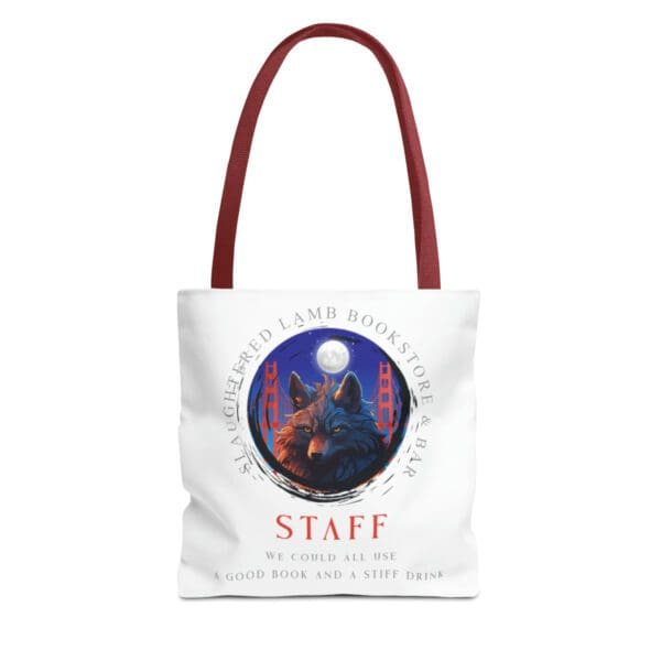 A red handled tote bag with an image of a wolf and the words " staff ".