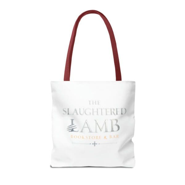 A white tote bag with red handles and the slaughter of lamb logo.