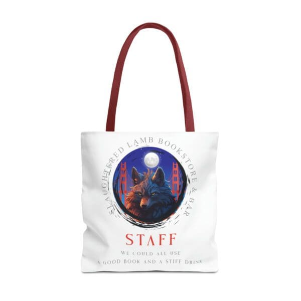 A red handled tote bag with an image of a wolf.