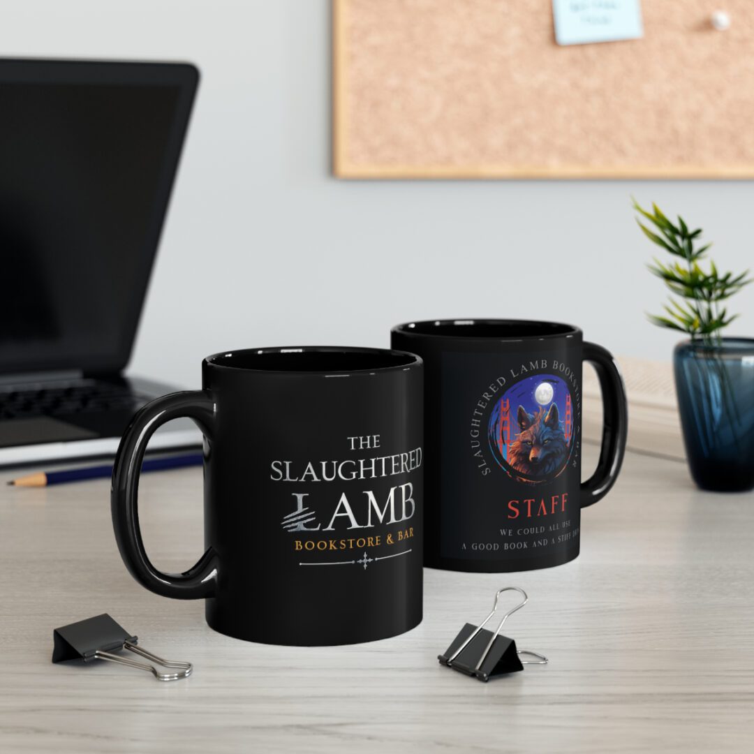 Two black mugs sitting on a desk next to some pencils.
