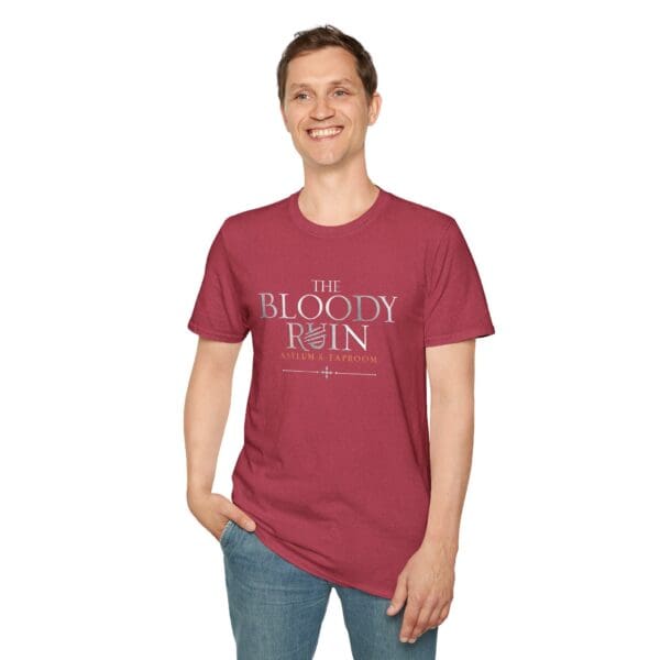 Man wearing maroon shirt with text.